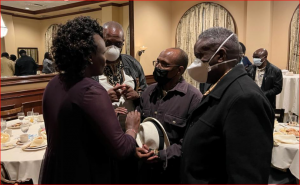 Joyce Ekuam, IEBC Director of Voter Education, Partnerships and Communication speaks with Dr. Omari Onyango, Chairman of Diaspora Consultative Group, and Dr. Nixon Mwebi and Dr. Ondieki Gekara after a dinner meeting hosted by IEBC to discuss how to improve the dismal registration numbers so far. | Maurice Ndole