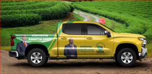 A campaign pick-up truck with Kimutai Diaz branding is parked at a tea plantation.