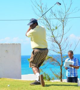 Eye on the ball, former Vice President Musalia Mudavadi using his driver club to swing at a golf ball. 