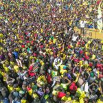 Supporters cheer Deputy President William Ruto at the final call in Nyayo Stadium, Nairobi