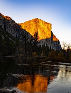 Sunset sprays golden rays on the majestic El Capitan. | Photo by Maurice Ndole
