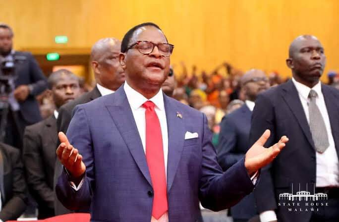 President Lazarus Chakwera praying