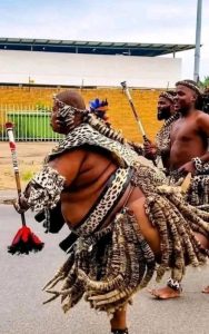 A protester in traditional attire appears in a widely shared image that has been used online to mock anti-migrant demonstrations in South Africa. The image shows how viral ridicule can overshadow deeper debates over nationalism, migration and African belonging.