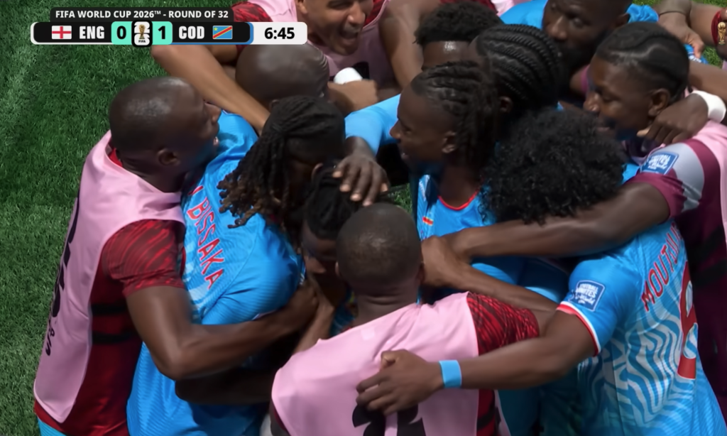 DR Congo players mob teammate Brian Cipenga after his seventh-minute strike put the Leopards ahead of England 1-0 in the Round of 32 at Mercedes-Benz Stadium in Atlanta on July 1, 2026.